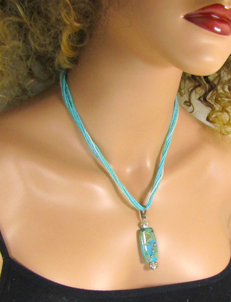Exotic Aqua Lampwork Pendant on Aqua Seed Bead Necklace