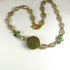 Quartz Crystal Necklace with Green and Gold Beaded Bead Accent