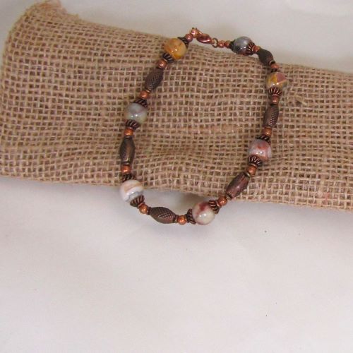 The warm glow of copper paired with agate gemstone beads in an anklet