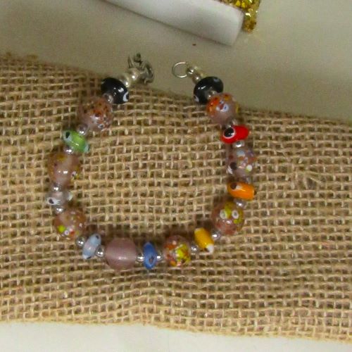 Whimsical multi-colored multi-style handmade bead  bracelet