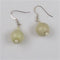 Handmade Kazuri bead cream earrings