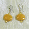 Bright yellow handmade Kazuri earrings