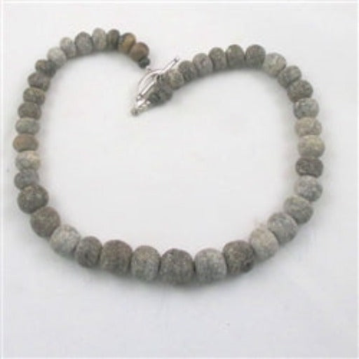 Rare petrified dinosaur bone bead neckalce