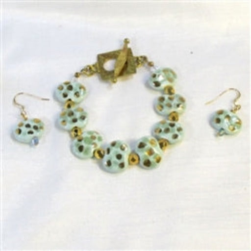 Buy aqua & gold Kazuri bracelet & earrings that are one of a kind