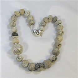 Buy rare & exotic petrified dinosaur bone & silver necklaced