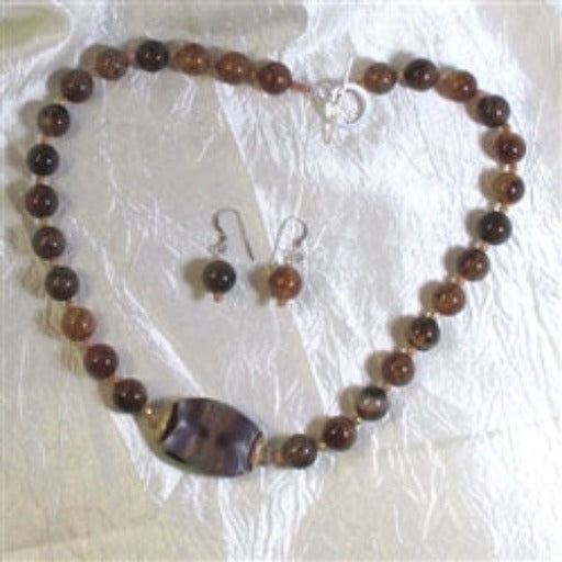 The beauty of natural agate paird with a handmade bead for this necklace & earring set