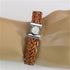 Tan braided leather bracelet for a man with tree of life clasp