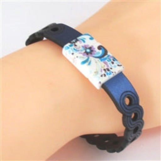 Metallic Bluelaser cut circle pattern  leather braclet with foral motif clasp