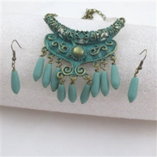 Handcrafted antique brass with turquoise patina silver focus accented with sea glass teardrops