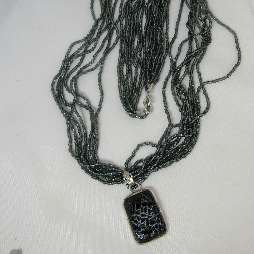Charcoal Multi-strand Necklace with Dinosaur Bone Pendant - VP's Jewelry