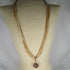 Flax Seed Bead Twisted Necklace with Gold Tone Pendant - VP's Jewelry