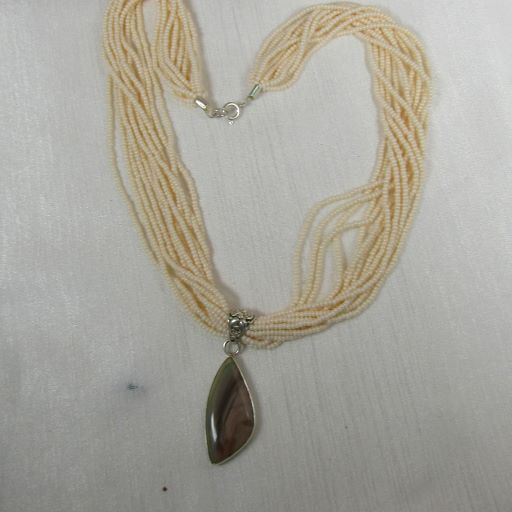 Cream  Multi-strand Necklace with  Petrified Wood Pendant