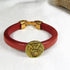 Red Regaliz Leather Bracelet with Gold Angel Coin Focus